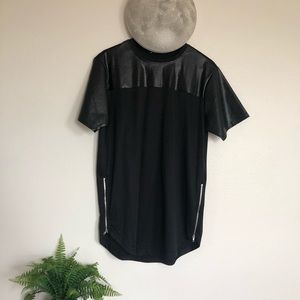Pleather/Cotten shortsleeved scallop tee.